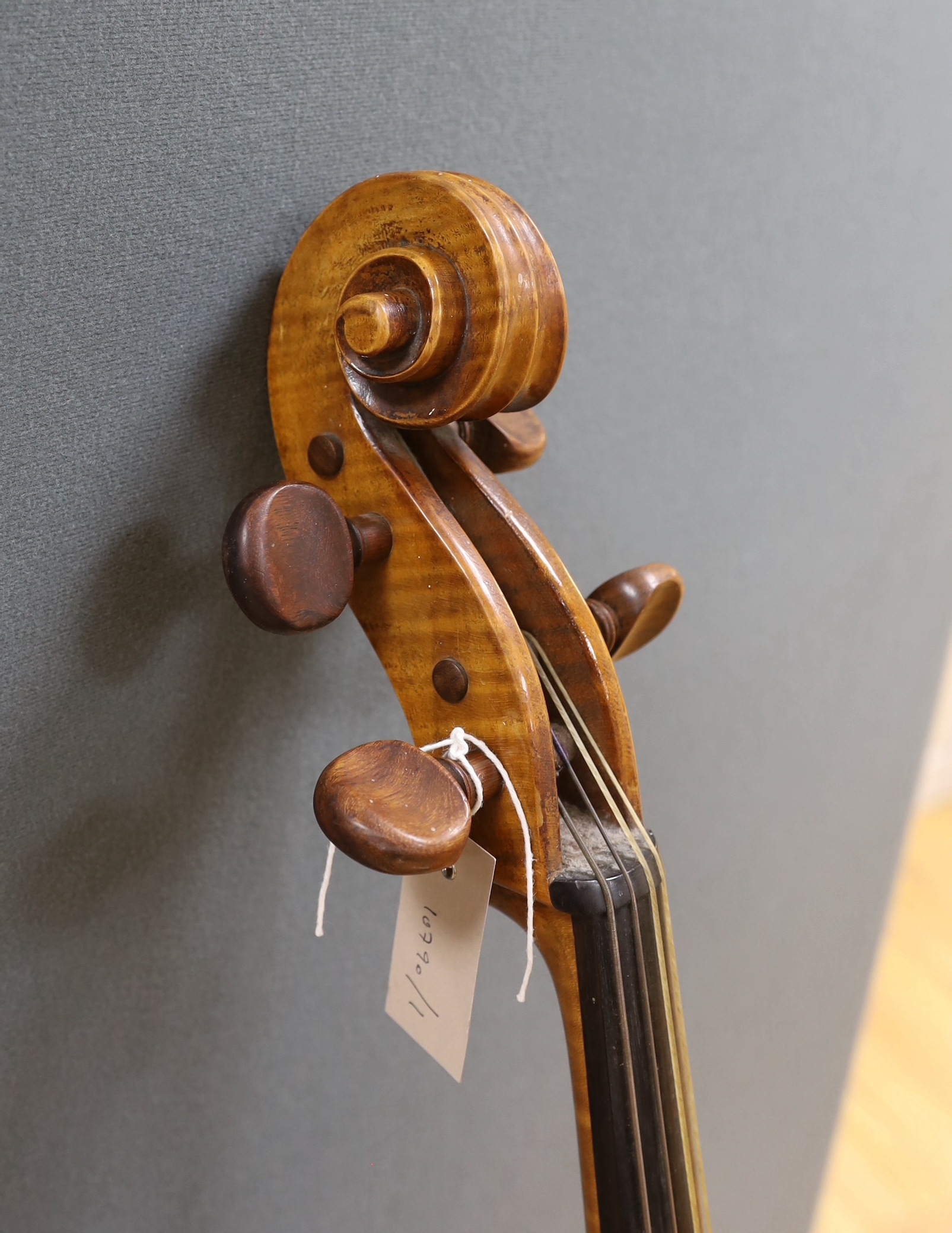 An early 20th century cello, back measures 76cm